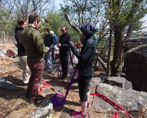 Arthur teaching the group how to daisy chain the webbing